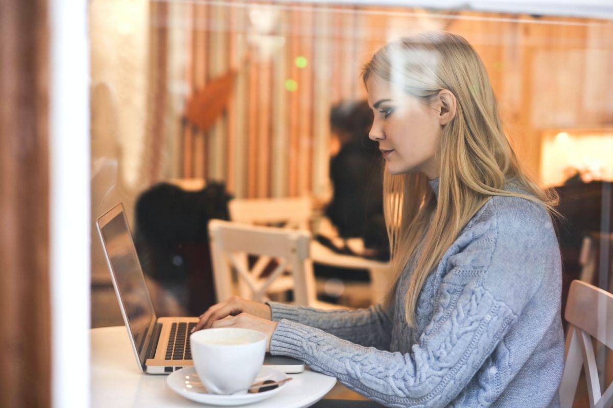 Lady in coffee shop on laptop