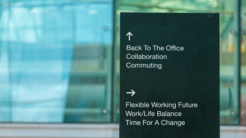sign with an upwards arrow pointing to the office and an arrow pointing right for flexible working