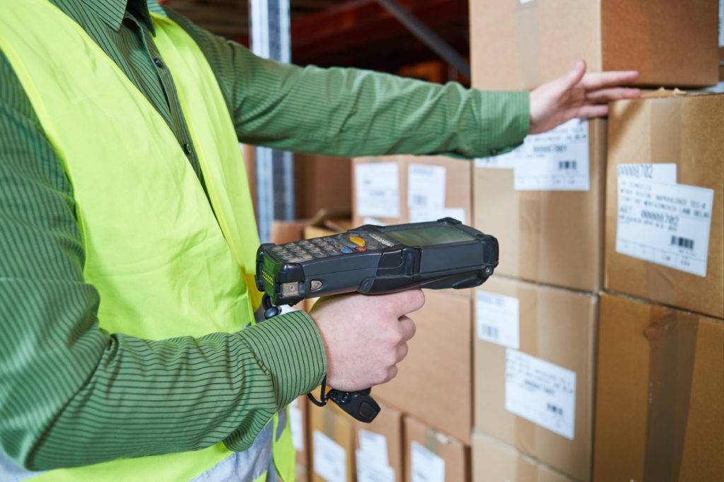 Warehouse employee scanning a box