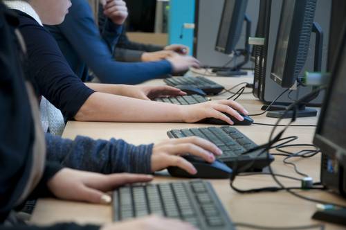 school pupils using computers